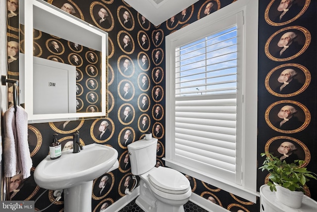 bathroom featuring sink and toilet