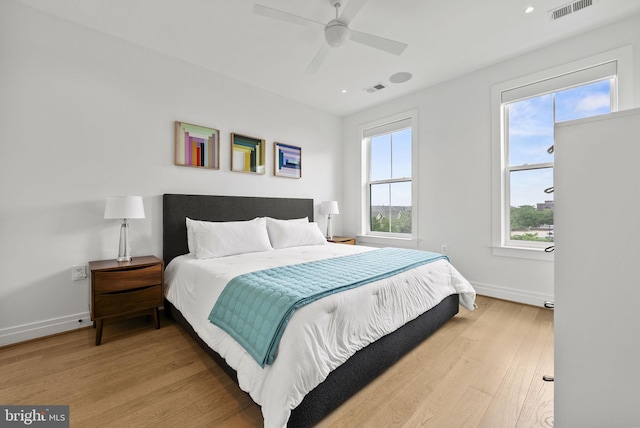 bedroom with ceiling fan and light wood-type flooring