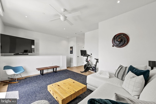 living room featuring hardwood / wood-style flooring and ceiling fan