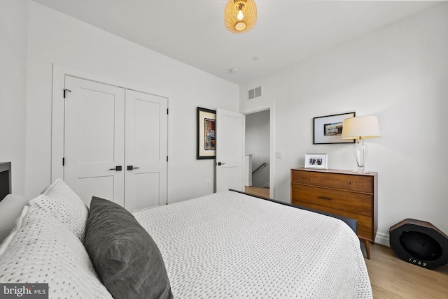 bedroom with a closet and light wood-type flooring