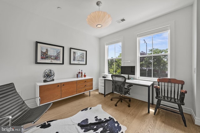 home office featuring light hardwood / wood-style floors