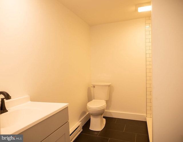 bathroom featuring vanity, tile patterned floors, toilet, and baseboard heating