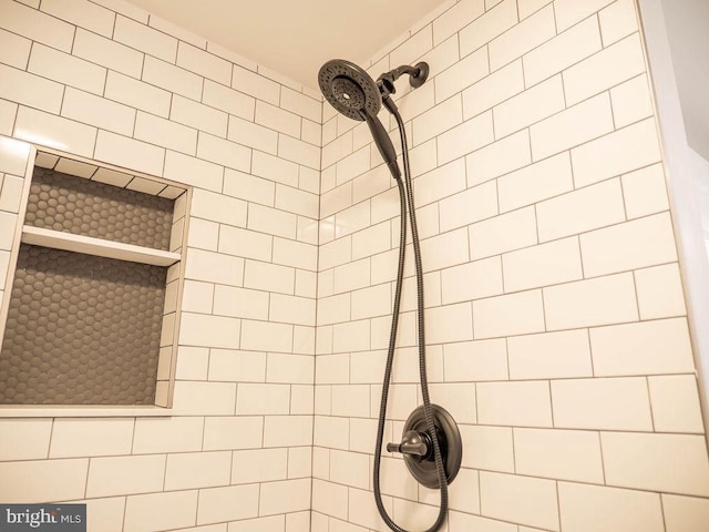 bathroom with tiled shower