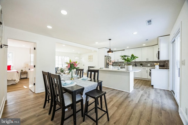 dining space featuring light hardwood / wood-style floors