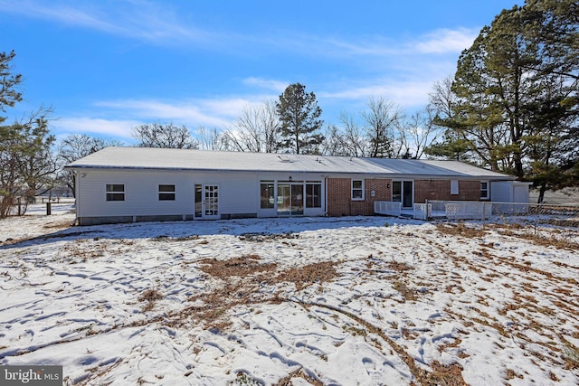 view of snow covered house