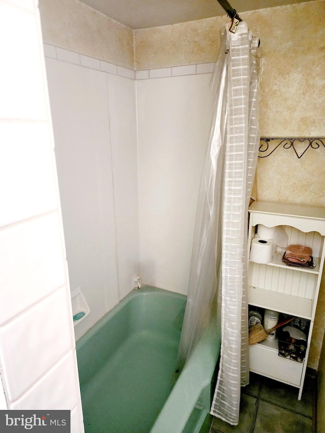 bathroom with tile patterned floors and shower / bath combination with curtain