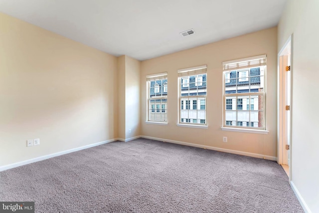 empty room featuring carpet flooring