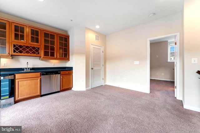 kitchen featuring dishwasher, sink, light carpet, and beverage cooler