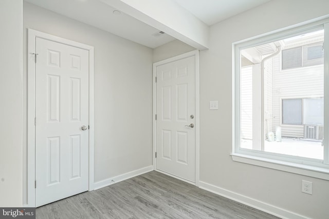 entryway with light hardwood / wood-style floors