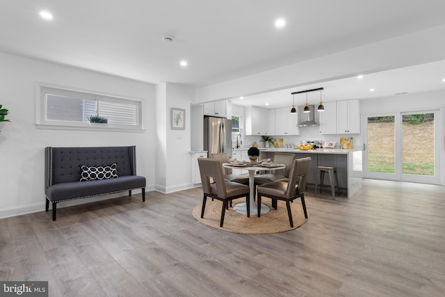 dining room with light hardwood / wood-style floors