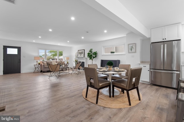 dining area with light hardwood / wood-style flooring