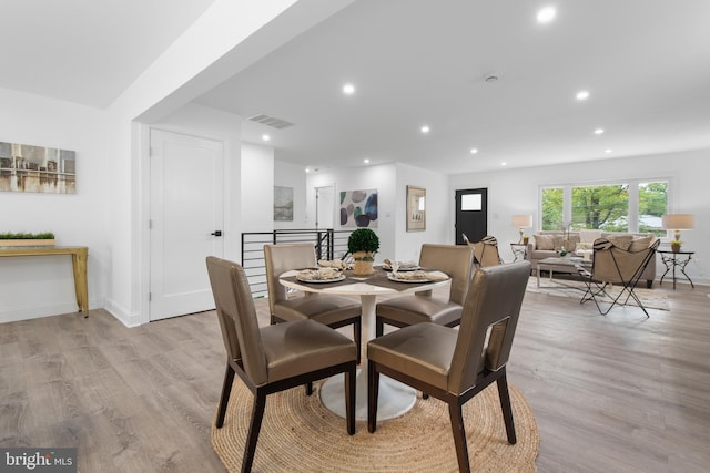 dining space featuring light hardwood / wood-style flooring