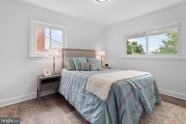 bedroom featuring dark wood-type flooring