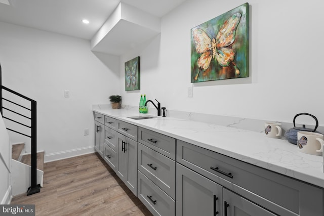 bathroom with vanity and hardwood / wood-style flooring