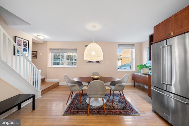 dining space featuring light hardwood / wood-style flooring