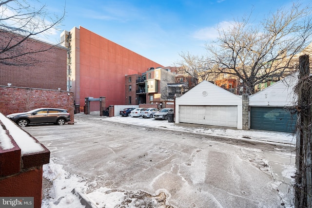 exterior space featuring a garage and an outdoor structure