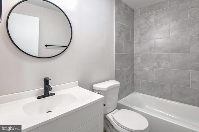 full bathroom featuring vanity, toilet, and tiled shower / bath combo