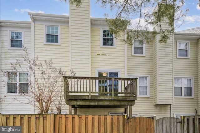 rear view of property featuring a balcony