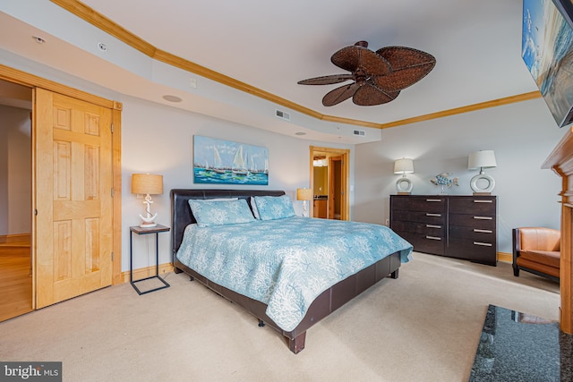 carpeted bedroom with crown molding and ceiling fan