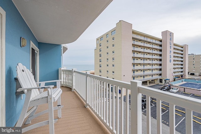 balcony featuring a water view