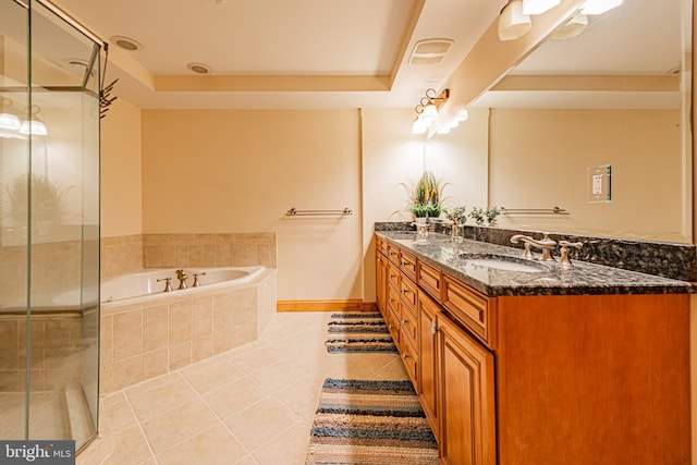 bathroom with tile patterned flooring, vanity, independent shower and bath, and a tray ceiling