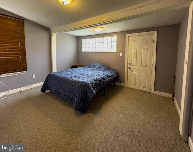 bedroom with carpet and baseboards