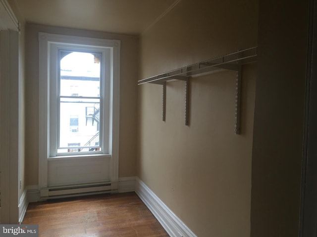 doorway featuring hardwood / wood-style flooring and a baseboard radiator