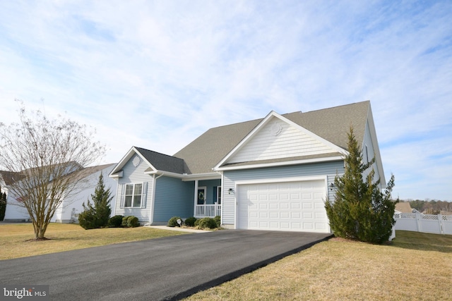 ranch-style house with a garage, a porch, and a front lawn