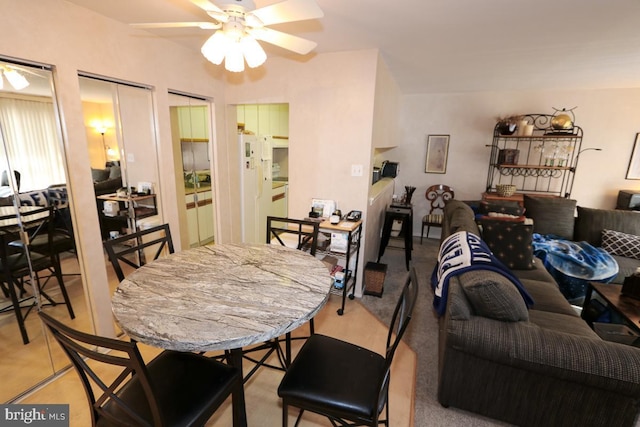 dining room featuring ceiling fan