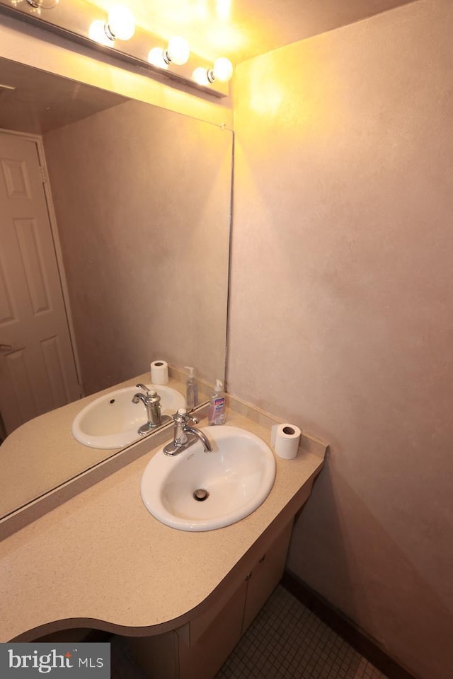 bathroom featuring tile patterned flooring and sink