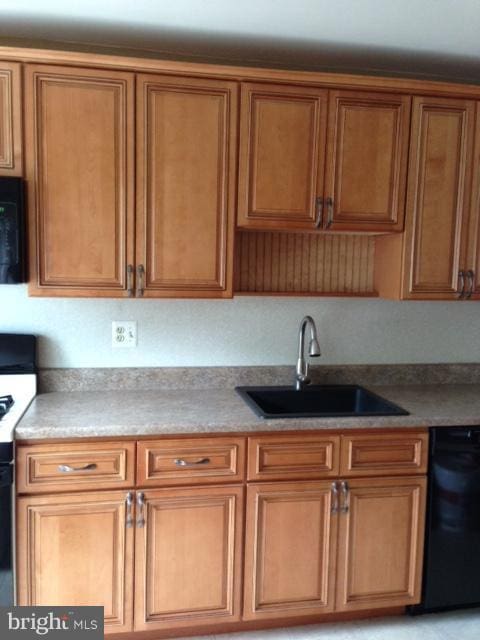 kitchen featuring sink and black appliances