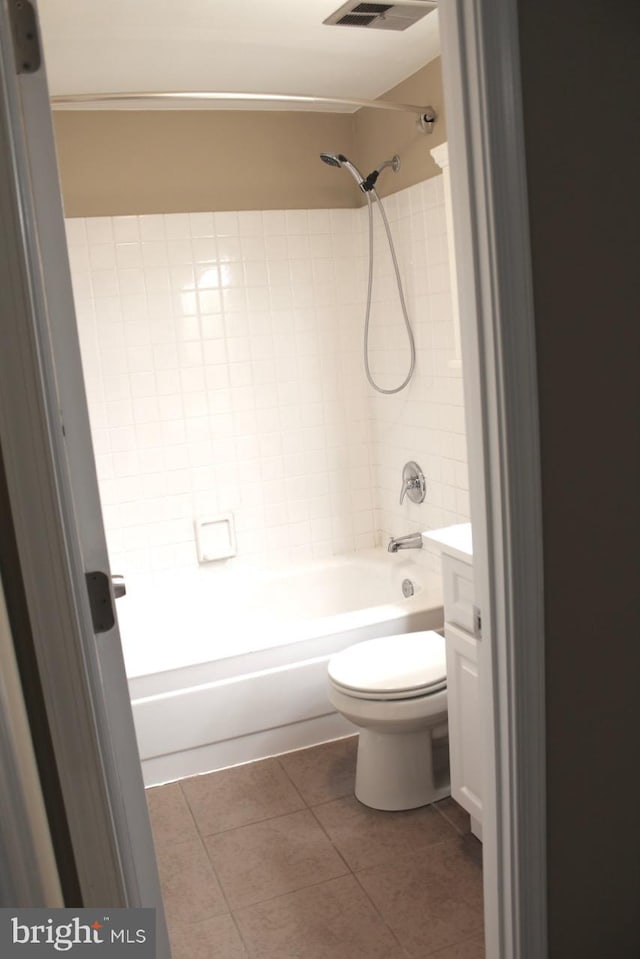 full bathroom featuring shower / bathtub combination, tile patterned floors, toilet, and vanity