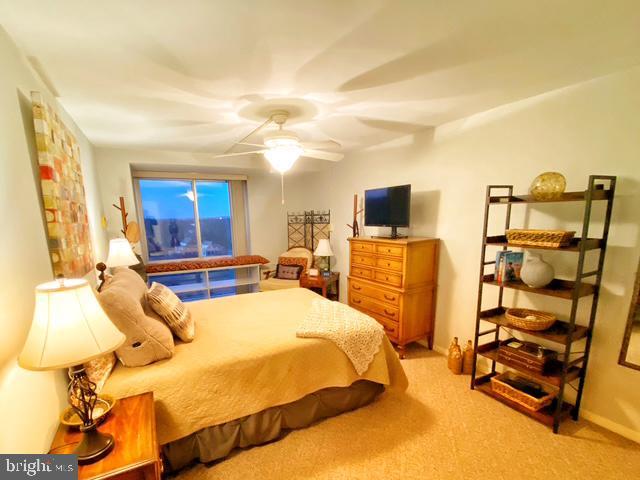 bedroom with light colored carpet and ceiling fan