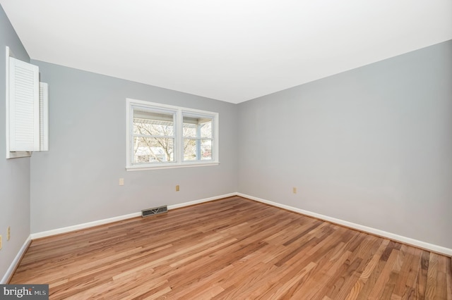 spare room with light hardwood / wood-style flooring