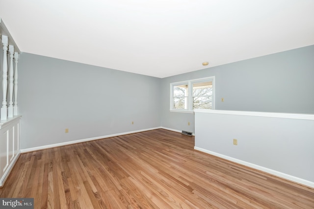 spare room with light hardwood / wood-style floors