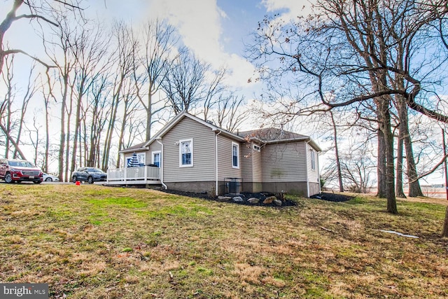 view of home's exterior with a lawn