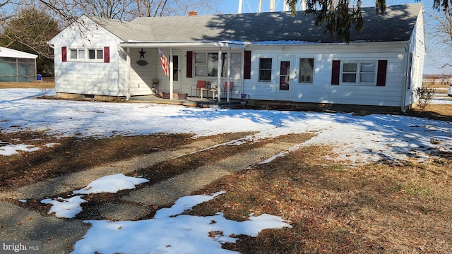 view of front of property featuring a porch and a shingled roof