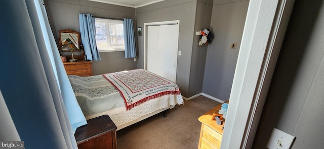 bedroom with carpet floors and baseboards