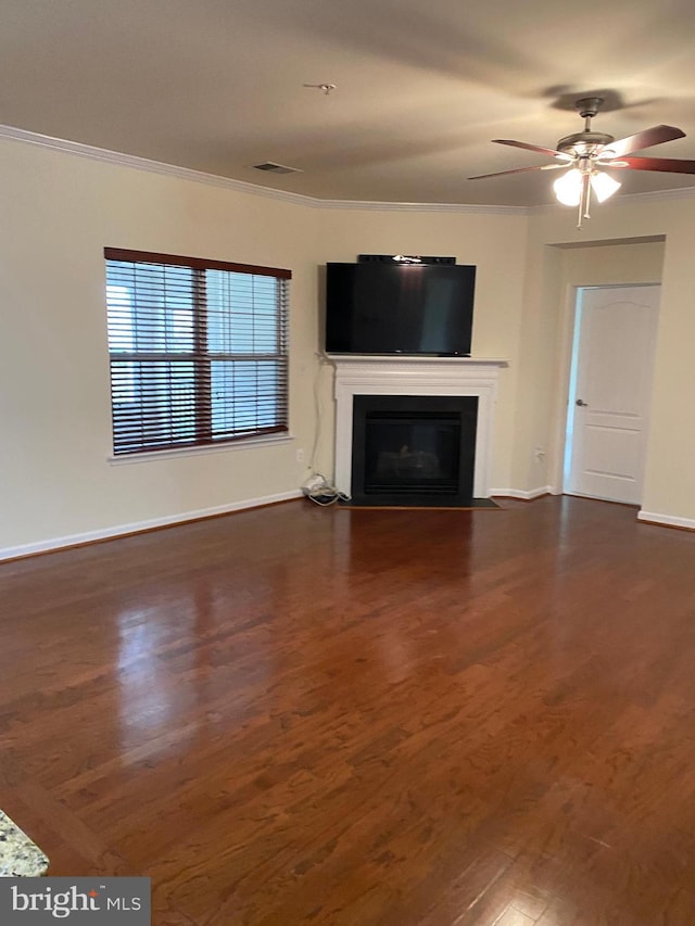 unfurnished living room with crown molding, ceiling fan, and dark hardwood / wood-style floors