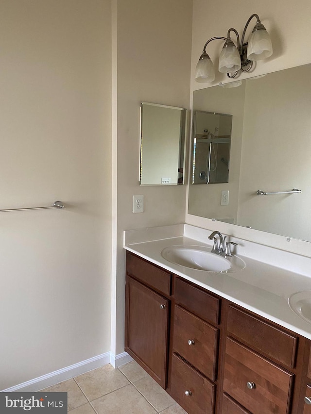 bathroom featuring vanity and tile patterned flooring