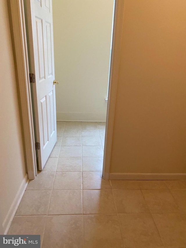 hallway with light tile patterned floors