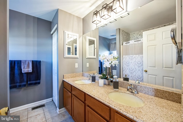 bathroom with vanity, curtained shower, tile patterned floors, and toilet