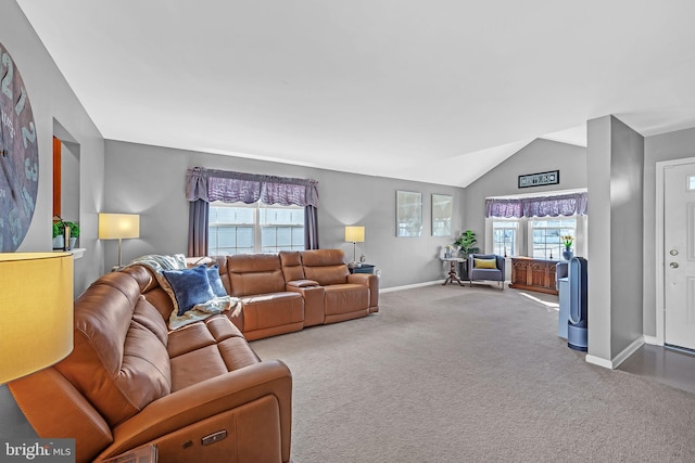 carpeted living room featuring lofted ceiling and a healthy amount of sunlight