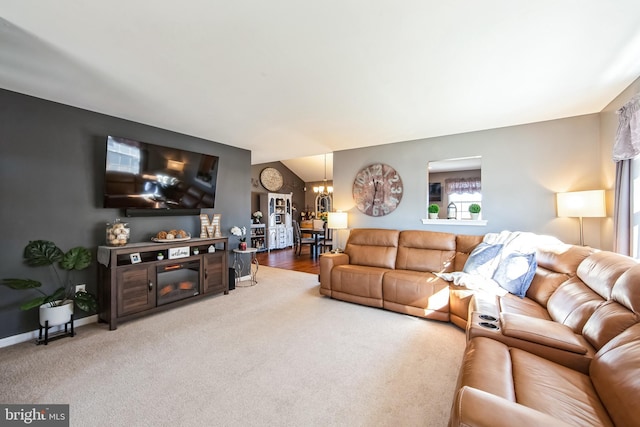 carpeted living room featuring an inviting chandelier and lofted ceiling