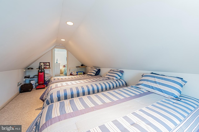 carpeted bedroom with vaulted ceiling