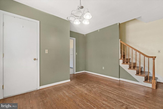 interior space with a notable chandelier and hardwood / wood-style flooring