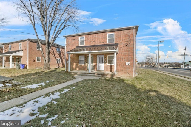 view of front property featuring a porch and a front lawn