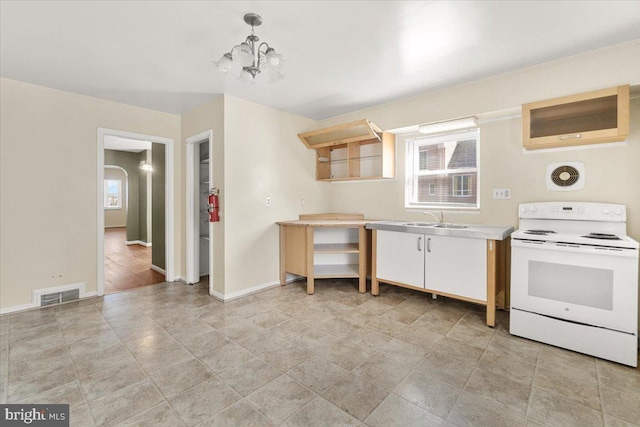 kitchen featuring white electric stove, hanging light fixtures, sink, and an inviting chandelier