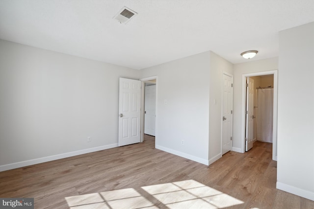 unfurnished bedroom with light hardwood / wood-style flooring