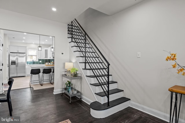 staircase featuring hardwood / wood-style floors